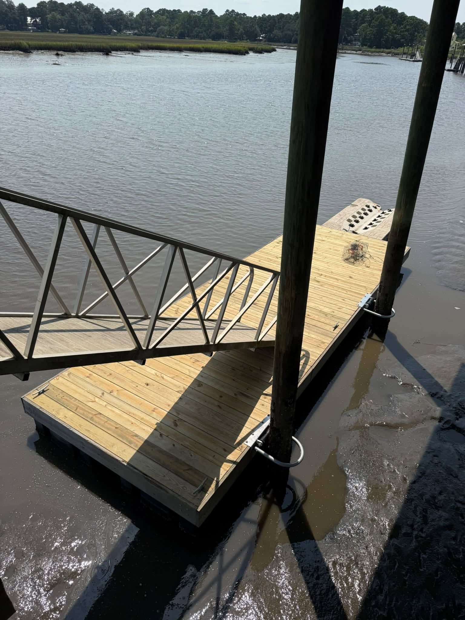 Floating dock and aluminum gangway on a tidal river
