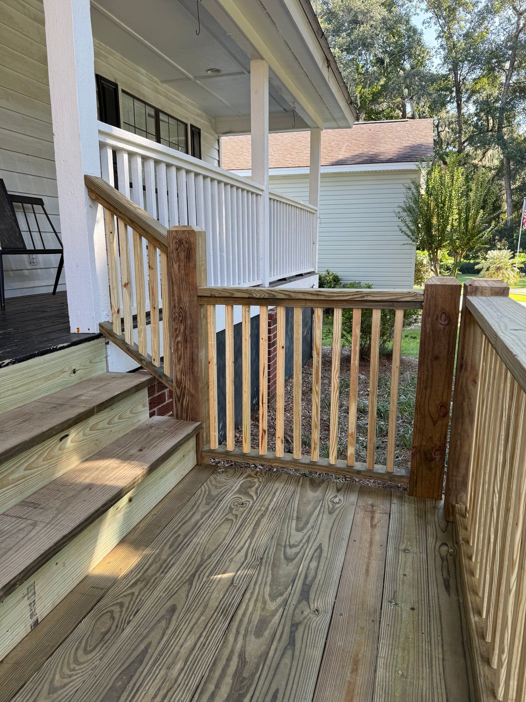 New stair landing with wood balusters and square posts